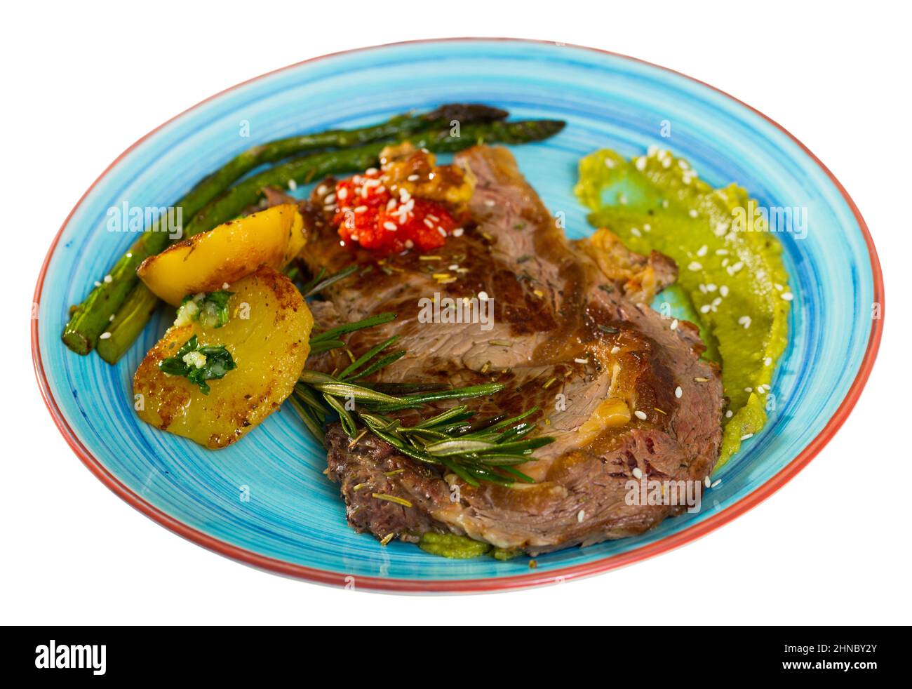 Grilled veal loin with guacamole and baked vegetables Stock Photo Alamy