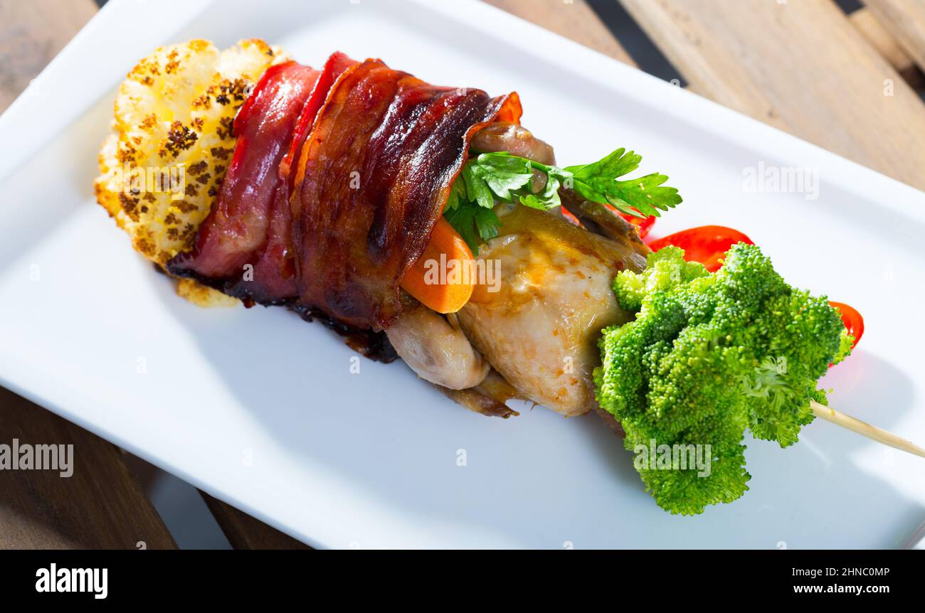Grilled quail with jamon on skewer with vegetables Stock Photo Alamy