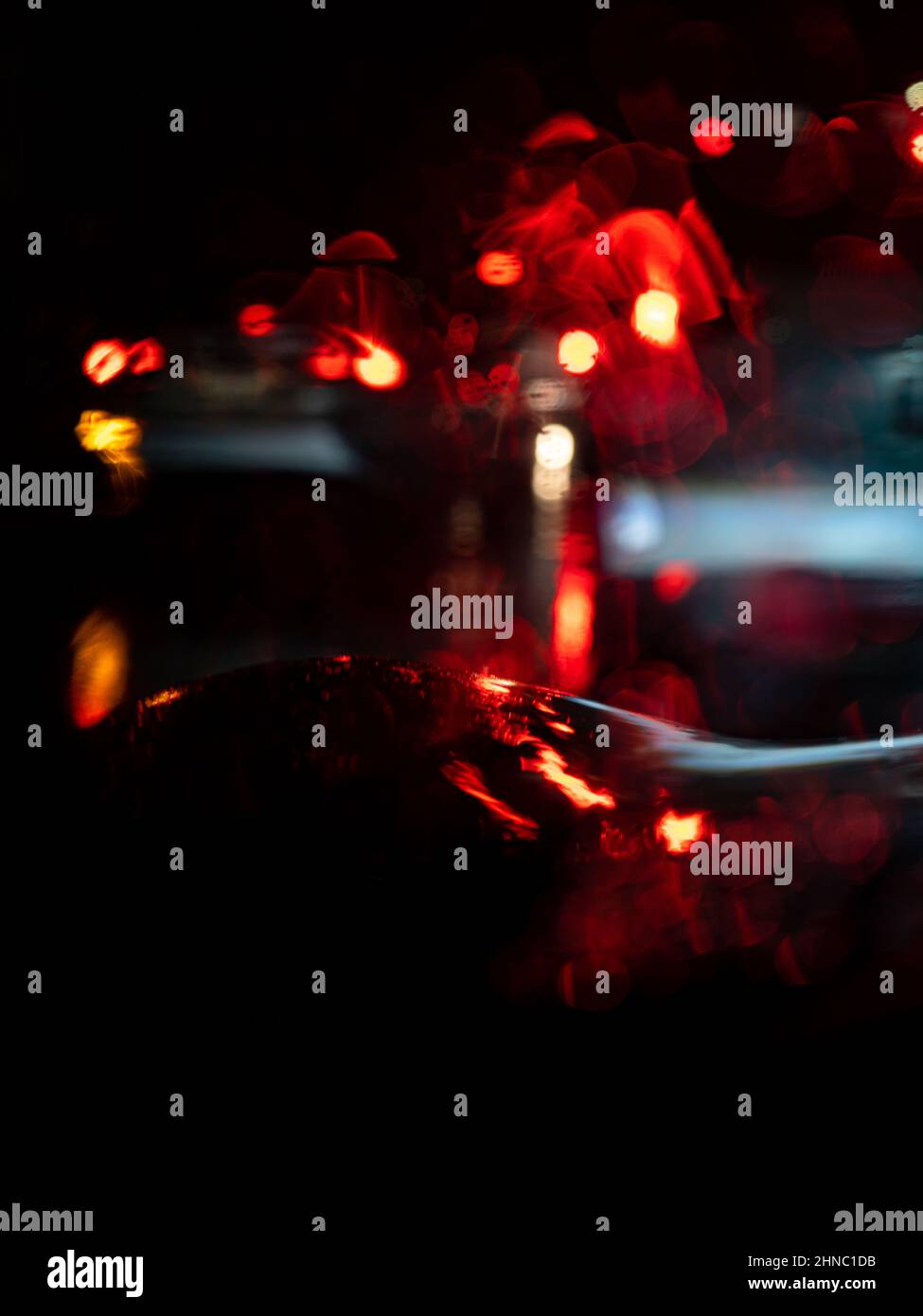 Vertical shot of vivid red lights in the street at night Stock Photo ...