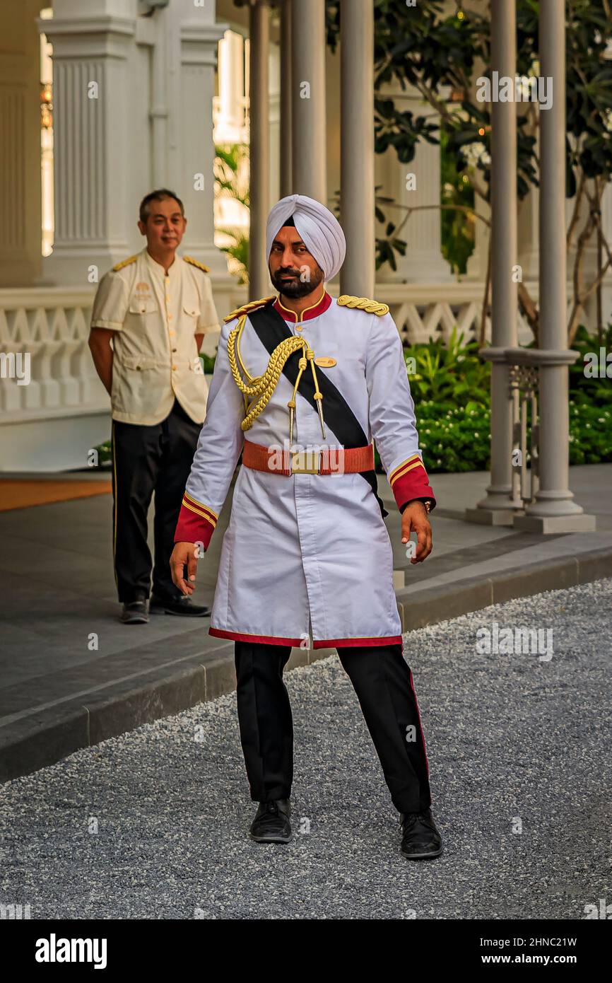 Singapore - September 08, 2019: Sikh doorman in a military uniform on duty at the iconic Raffles Hotel Stock Photo