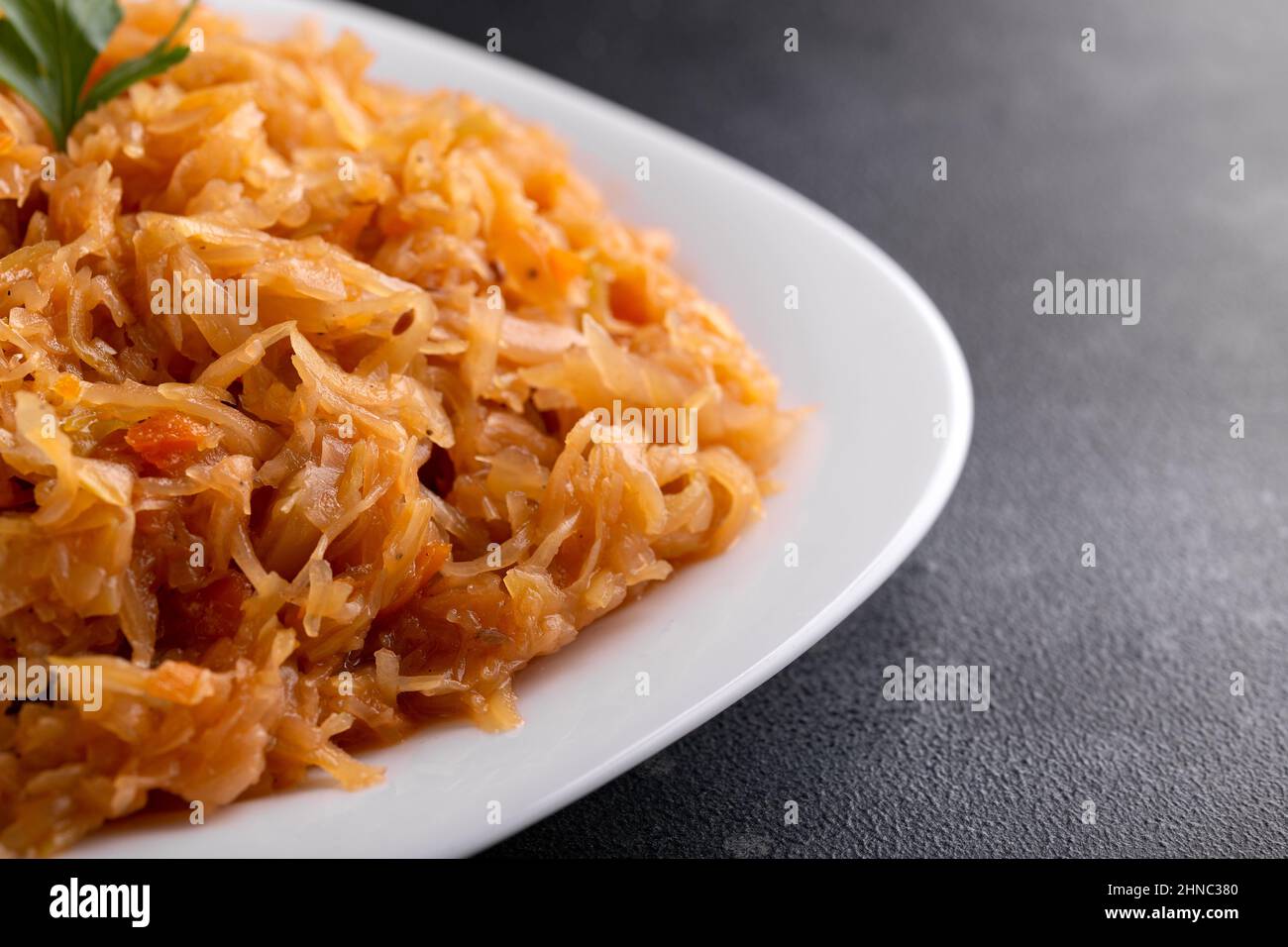 Traditional Homemade Stewed cabbage on white plate Stock Photo