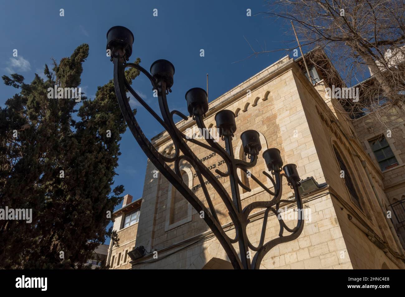 The Jewish Menorah placed outside the Conegliano Veneto Synagogue and the Italian Jewish Museum in Hilel street West Jerusalem Israel Stock Photo