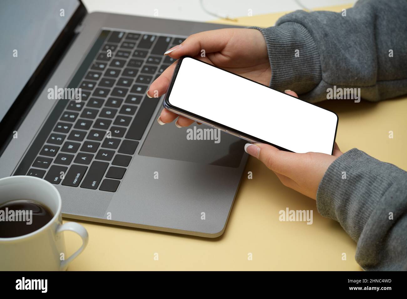 Close-up, rear view, A hipster woman or female college student using ...