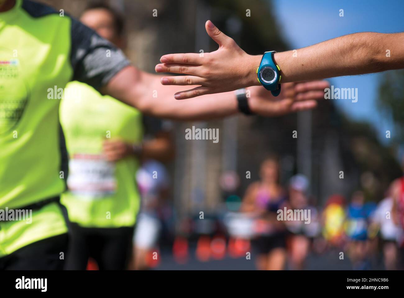 Clap hands of a runner and child fan Stock Photo