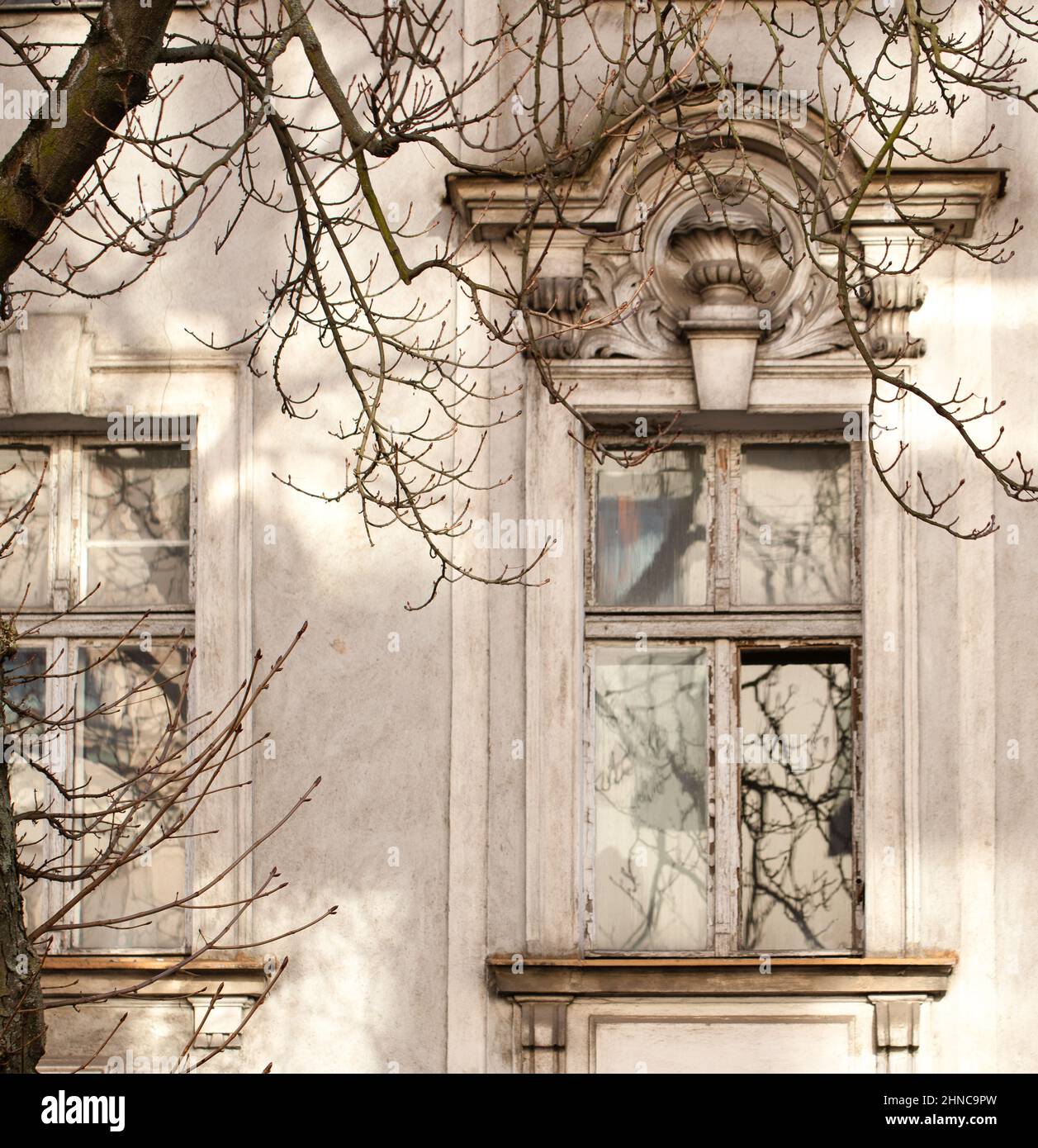 Glare And Window Reflections On The Facade Of An Old Tenement House 