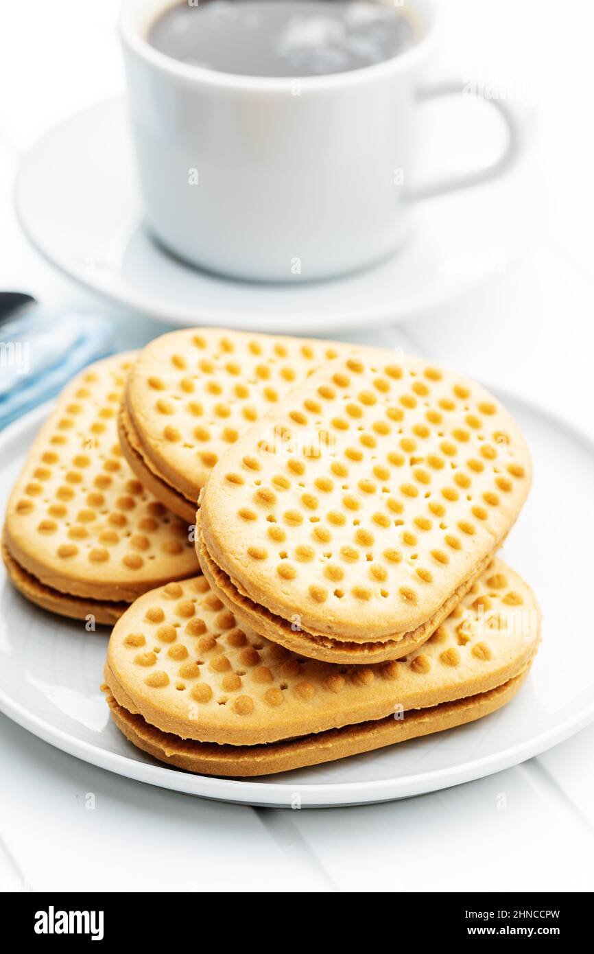 Sandwich biscuits with chocolate filling on a white background Stock