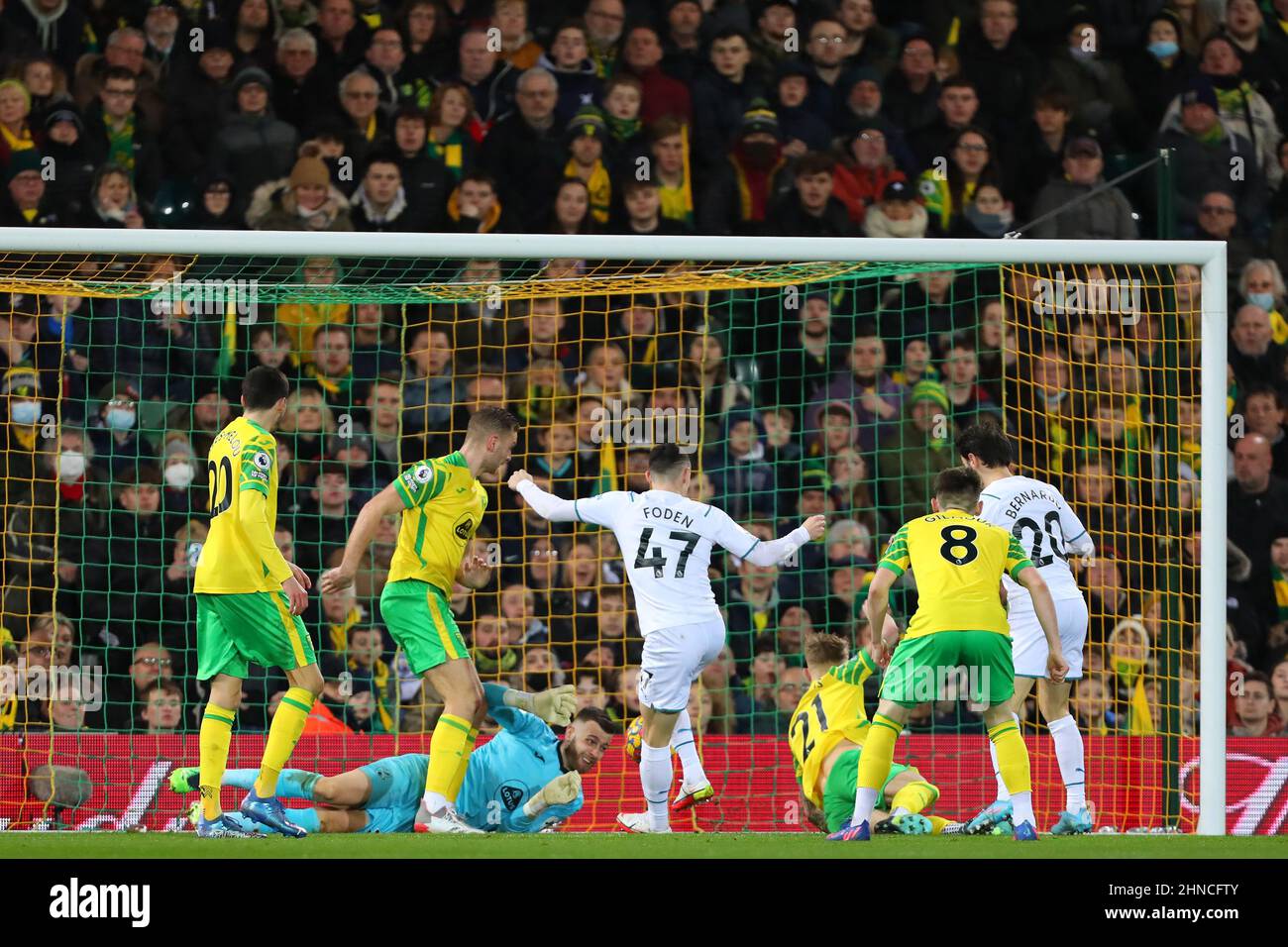 Phil Foden of Manchester City scores a goal to make 2-0 - Norwich City v Manchester City, Premier League, Carrow Road, Norwich, UK - 12th February 2022  Editorial Use Only - DataCo restrictions apply Stock Photo
