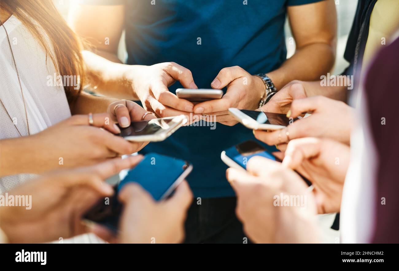 Lets get connected. Shot of unrecognizable people using smartphones outside. Stock Photo