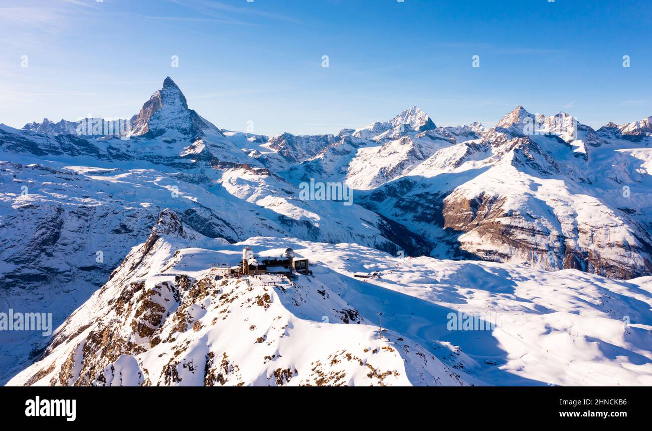 Mountain ridge Gornergrat with observatory on background of Matterhorn peak, Switzerland Stock Photo