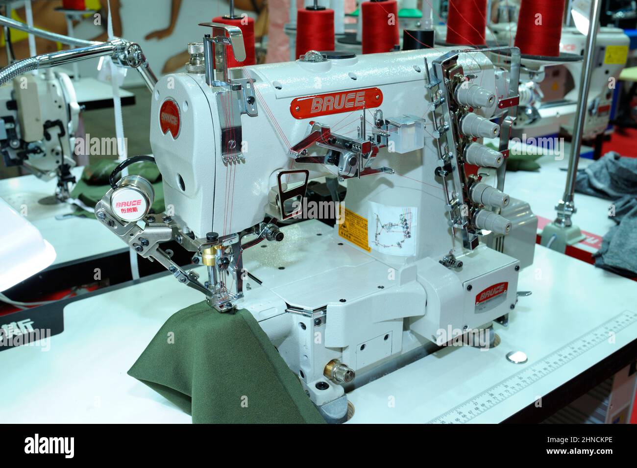 Pro electric sewing machine Bruce working on a worktable at the workshop.  February 2, 2022. Kyiv, Ukraine Stock Photo - Alamy
