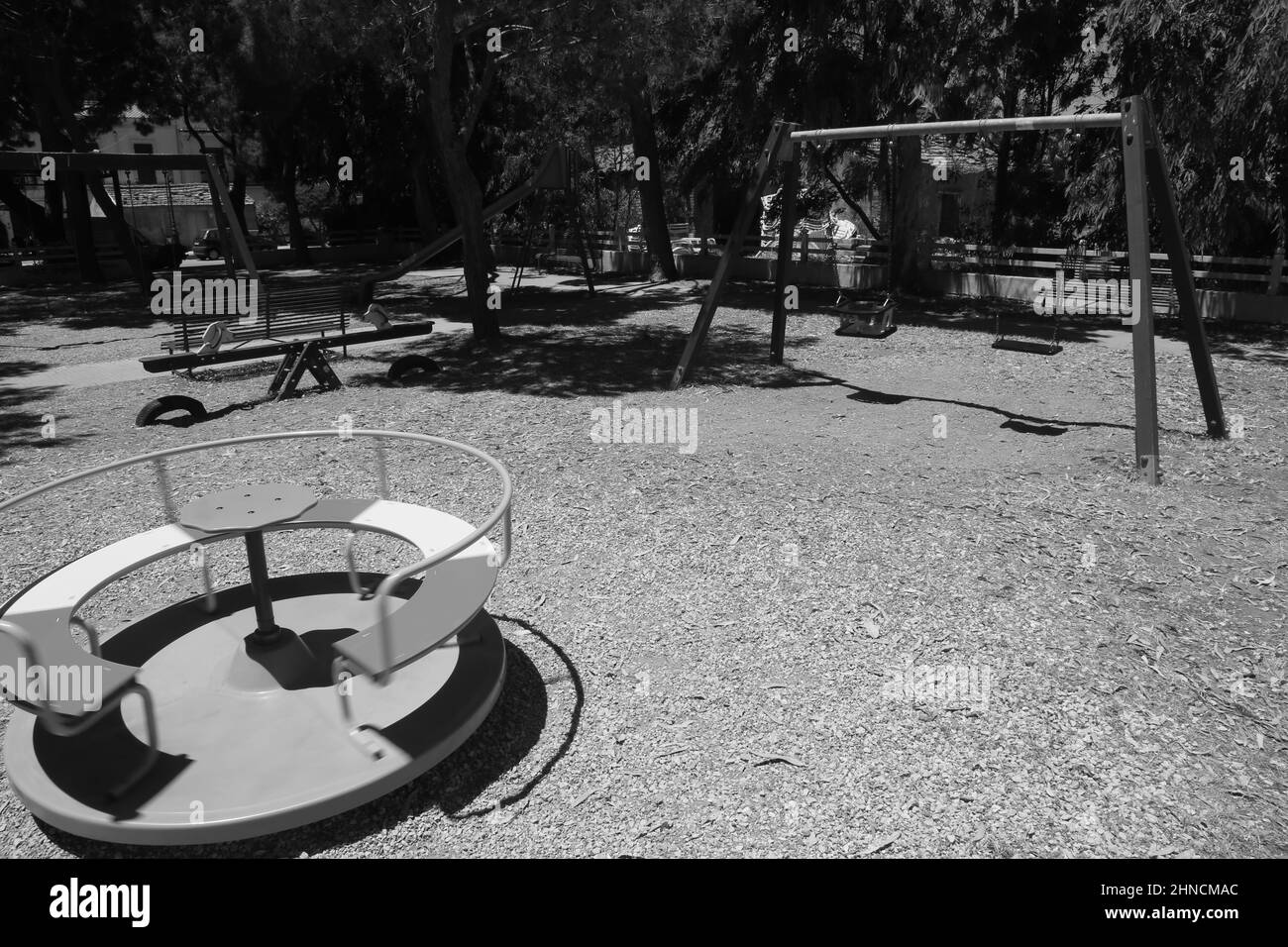 spinning roundabout in a playground without people Stock Photo