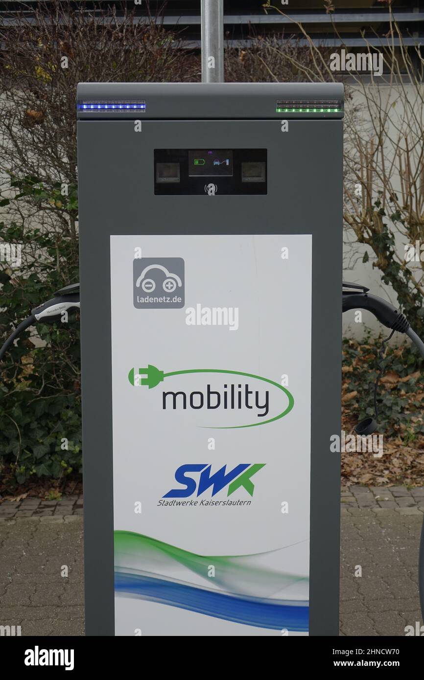 Gray SWK (Stadtwerke Kaiserslautern) charging station for electric cars with a plugin on each side, green mobility (vertical) Stock Photo