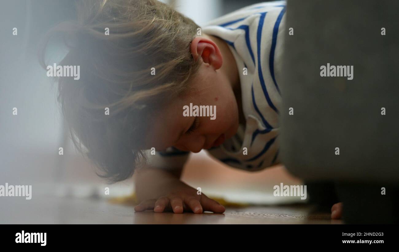 Child getting up from floor kid standing up Stock Photo Alamy