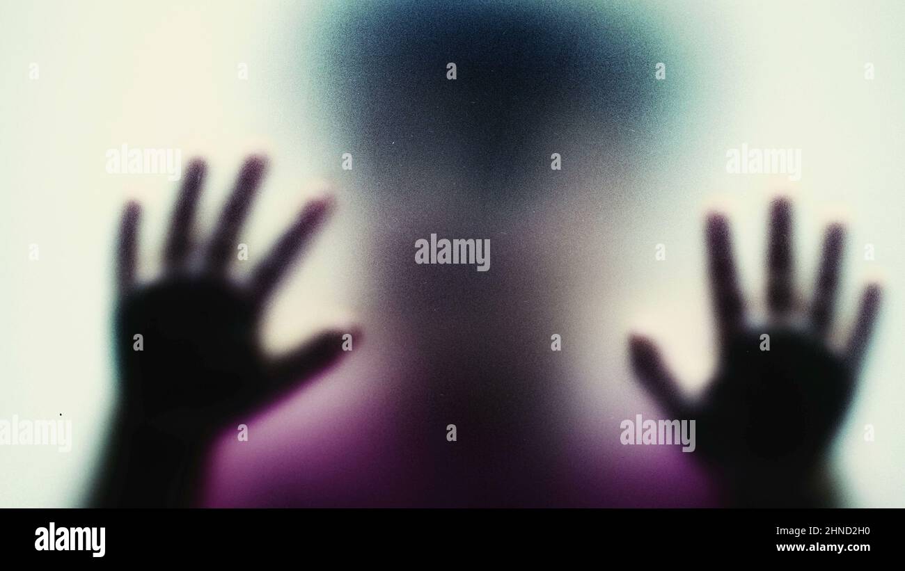 Child feeling trapped behind glass depression mental illness concept