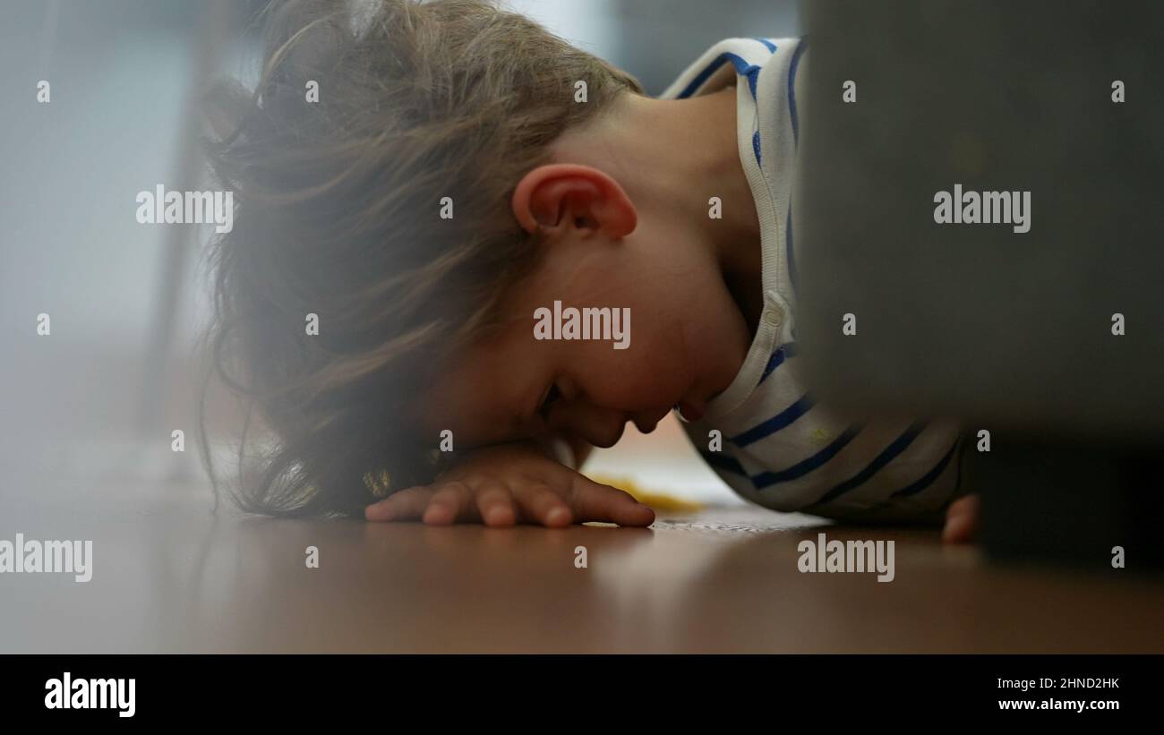 Child getting up from floor kid standing up Stock Photo Alamy