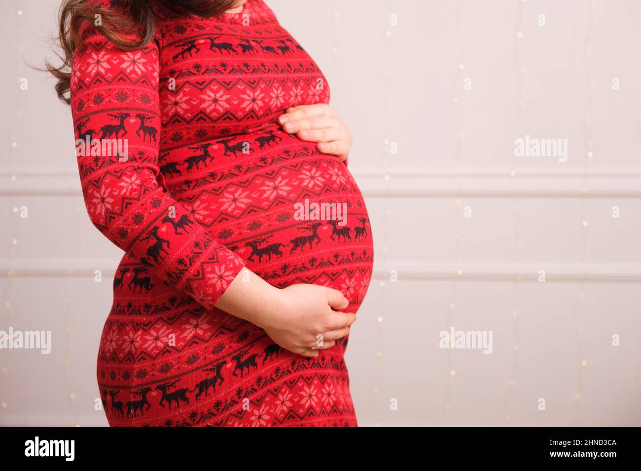 Pregnant woman in red dress hi-res stock photography and images - Alamy