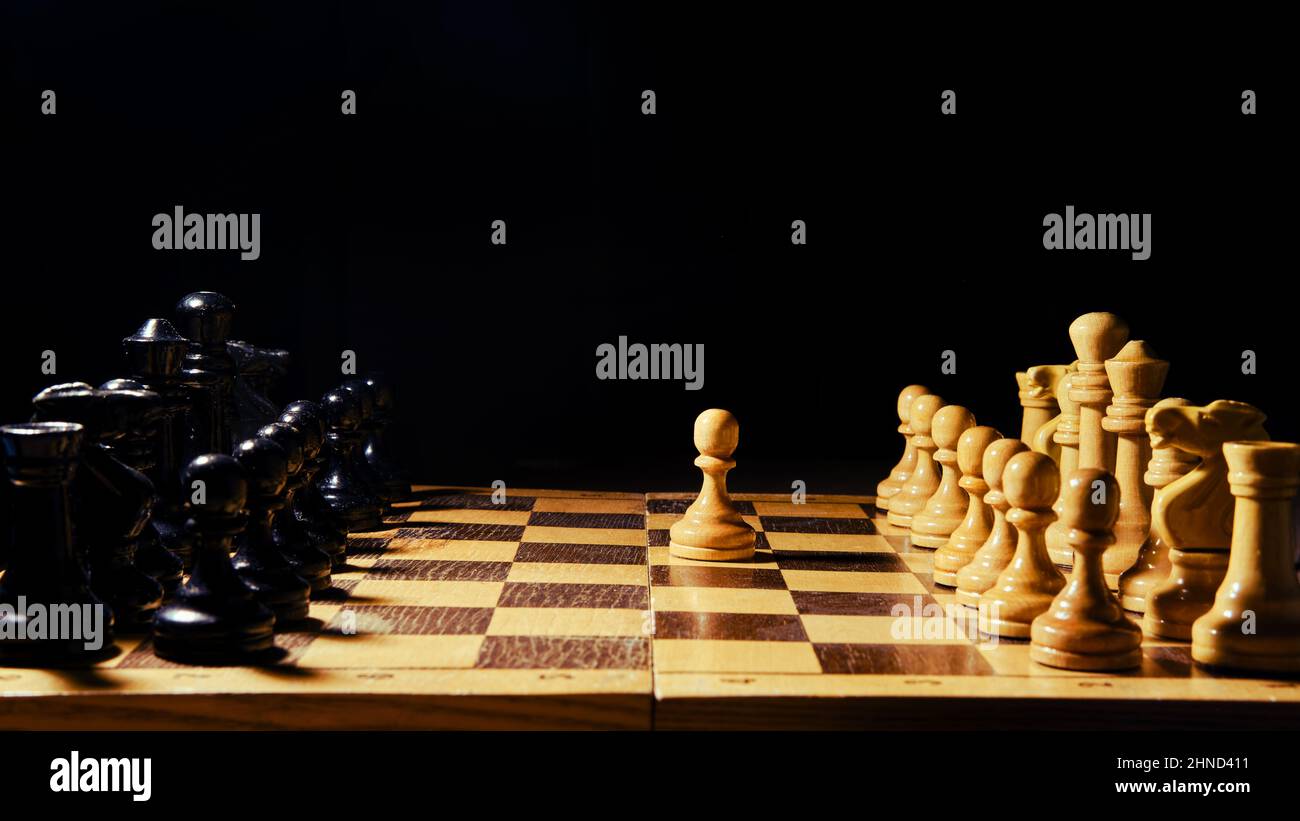 A Man Hand with a Chess Piece in a Board Game. Opening of the Chess Game  with the Move of the White King Pawn E2-e4, Copy Space on Stock Image -  Image