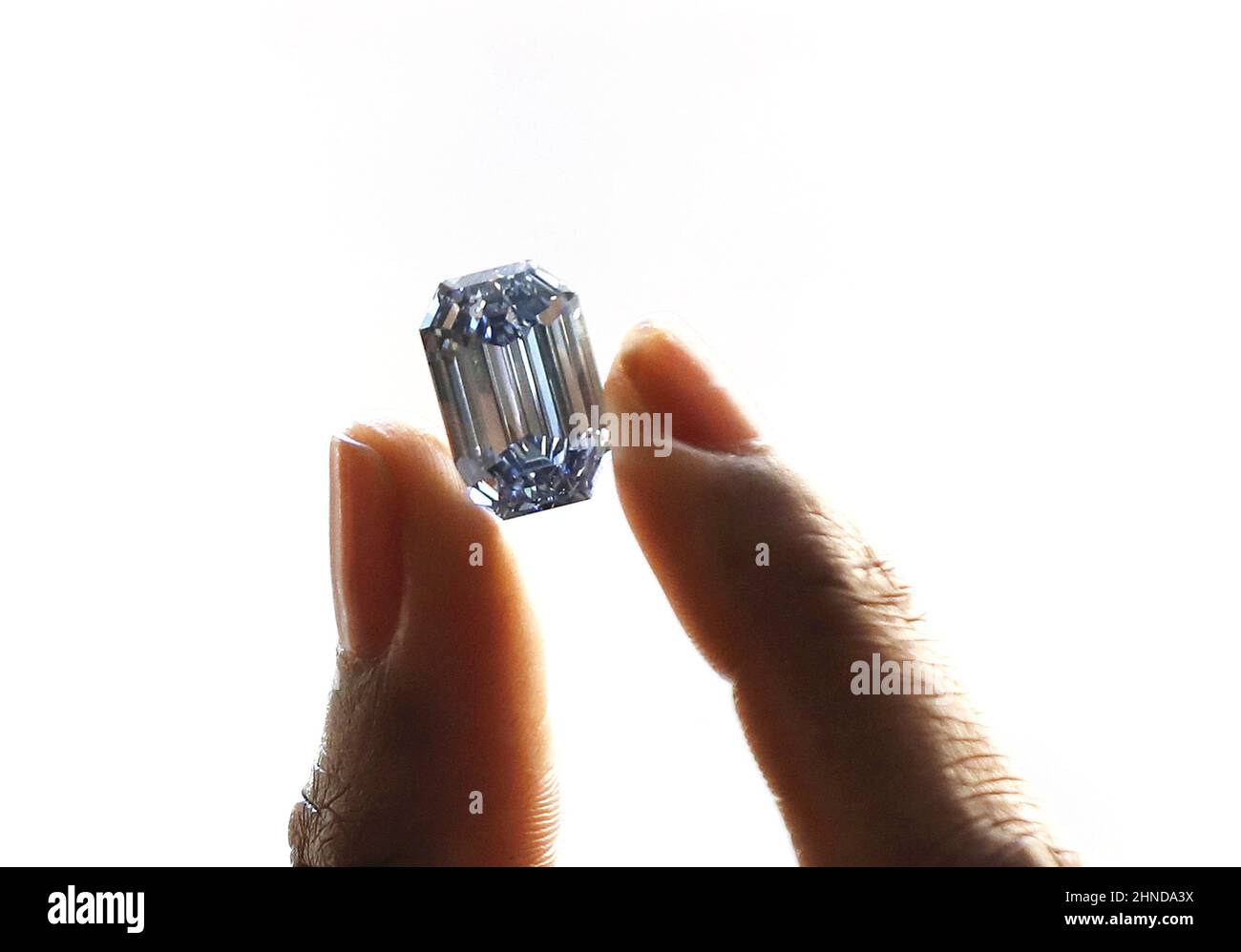 New York, United States. 16th Feb, 2022. The largest and most valuable blue diamond to ever appear at auction, 'The De Beers Cullinan Blue', is held by Stephany Martins at Sotheby's on Tuesday, February 15, 2022 in New York City. The diamond will be offered in a single-lot auction at Sotheby's Hong Kong this April and is expected to be sold at in excess of US$48 Million which is the highest estimate ever placed on a blue diamond. Photo by John Angelillo/UPI Credit: UPI/Alamy Live News Stock Photo