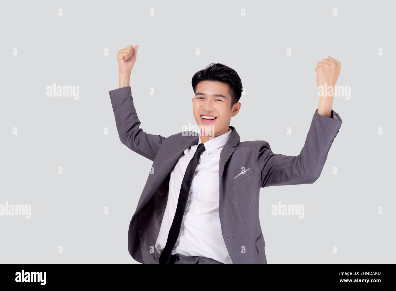 Portrait businessman in suit standing with win success isolated on ...