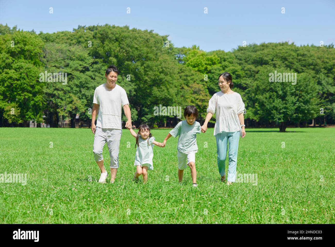 Japanese Parent And Child Holding Hands Stock Photo