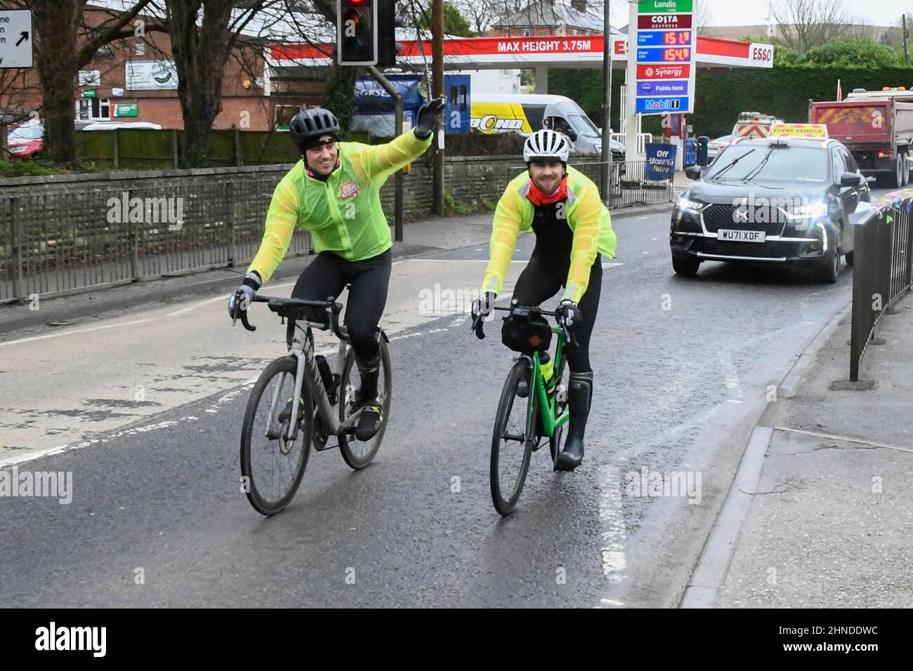 Winterbourne Abbas, Dorset, UK.  16th February 2022.  Olympic gold medalists Tom Daley OBE rides along the A35 through Winterbourne Abbas in Dorset on day 3 of his Comic Relief Hell of a Homecoming challenge from the Queen Elizabeth Olympic Park in Stratford to his hometown of Plymouth in Devon.  On this leg he is cycling 130 miles from Southampton to Bovey Castle on Dartmoor in Devon.  Picture Credit: Graham Hunt/Alamy Live News Stock Photo