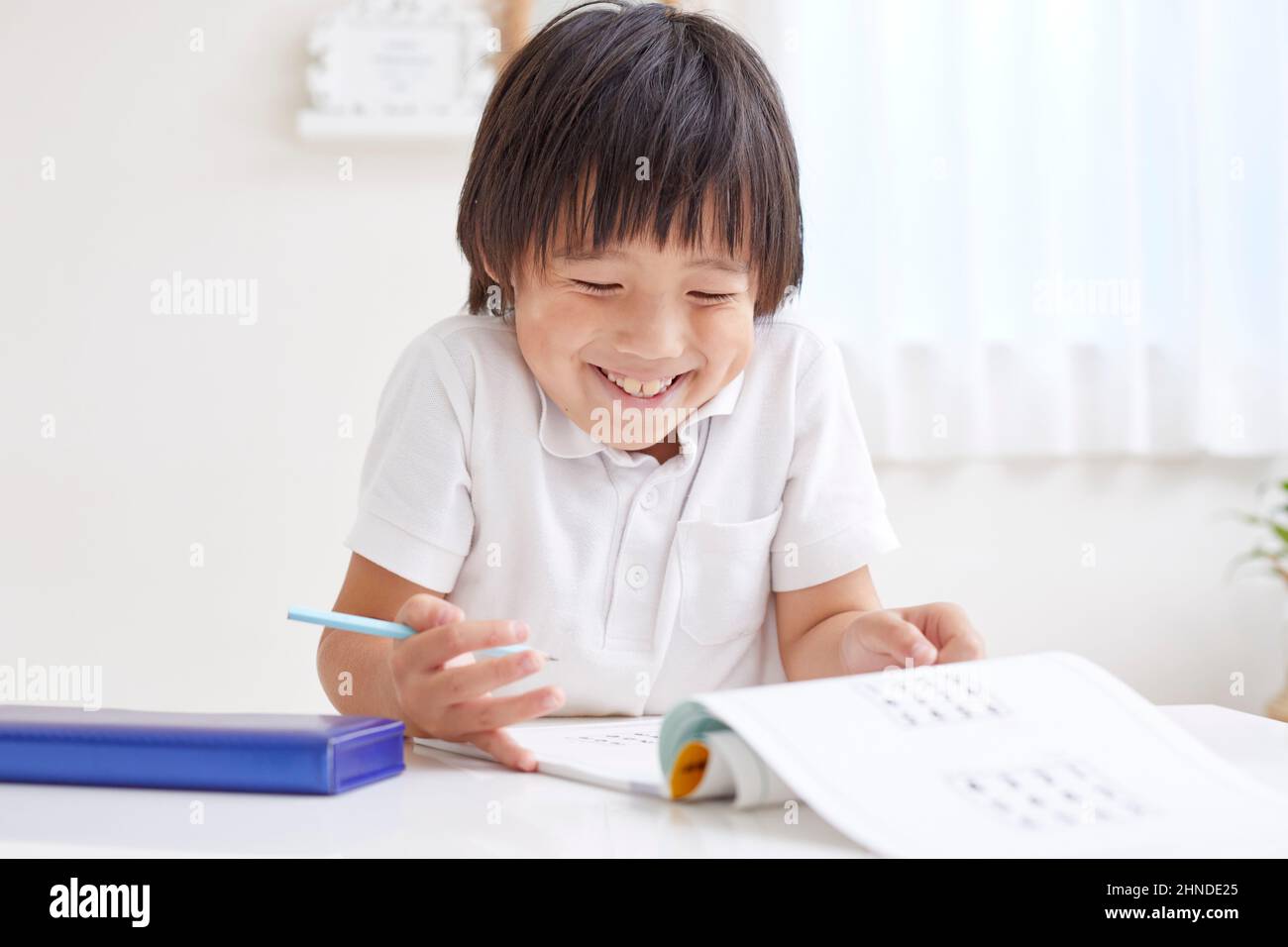 Japanese Elementary School Boy Doing His Homework Stock Photo Alamy