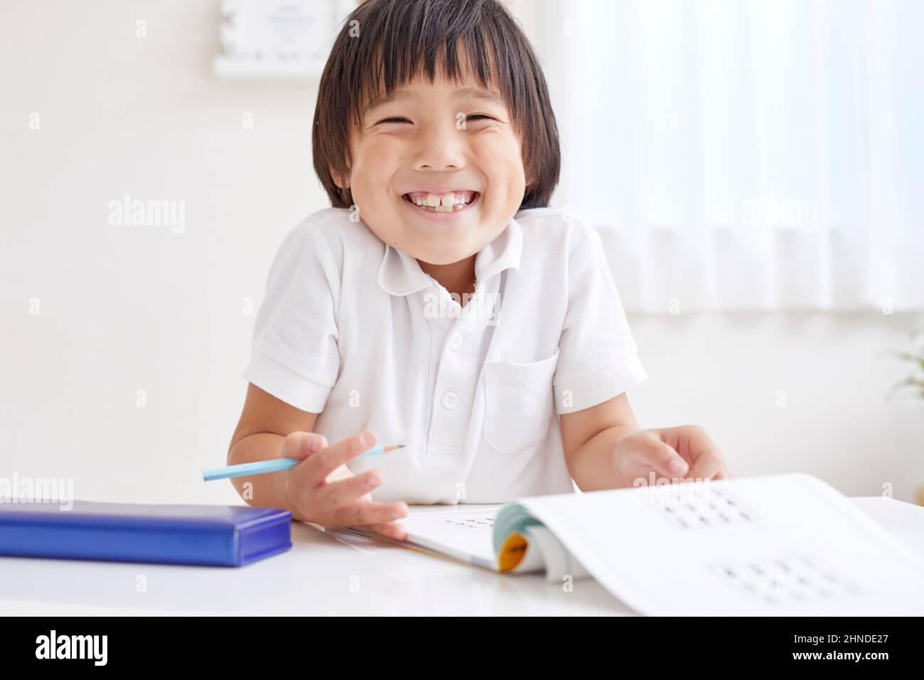 Japanese Elementary School Boy Doing His Homework Stock Photo Alamy
