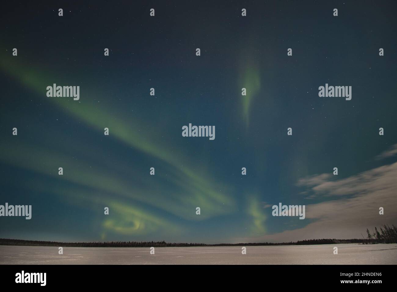 Breathtaking green dancing aurora borealis in the dark sky in Levi, lapland, Northern Finland
