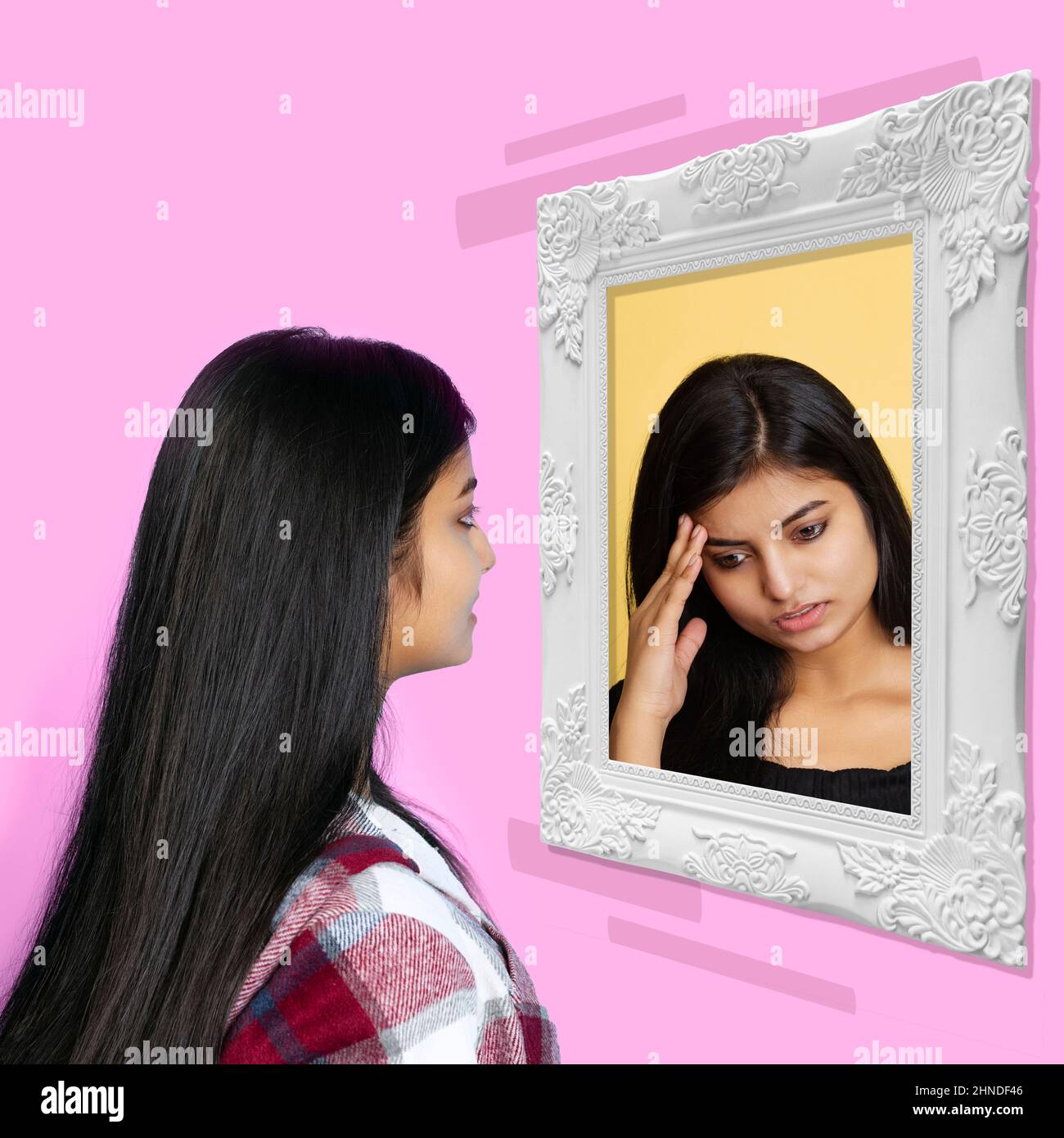 Young girl looking at mirror isolated on light background. Contemporary art collage. Concept of emotions, inner world, mental health Stock Photo