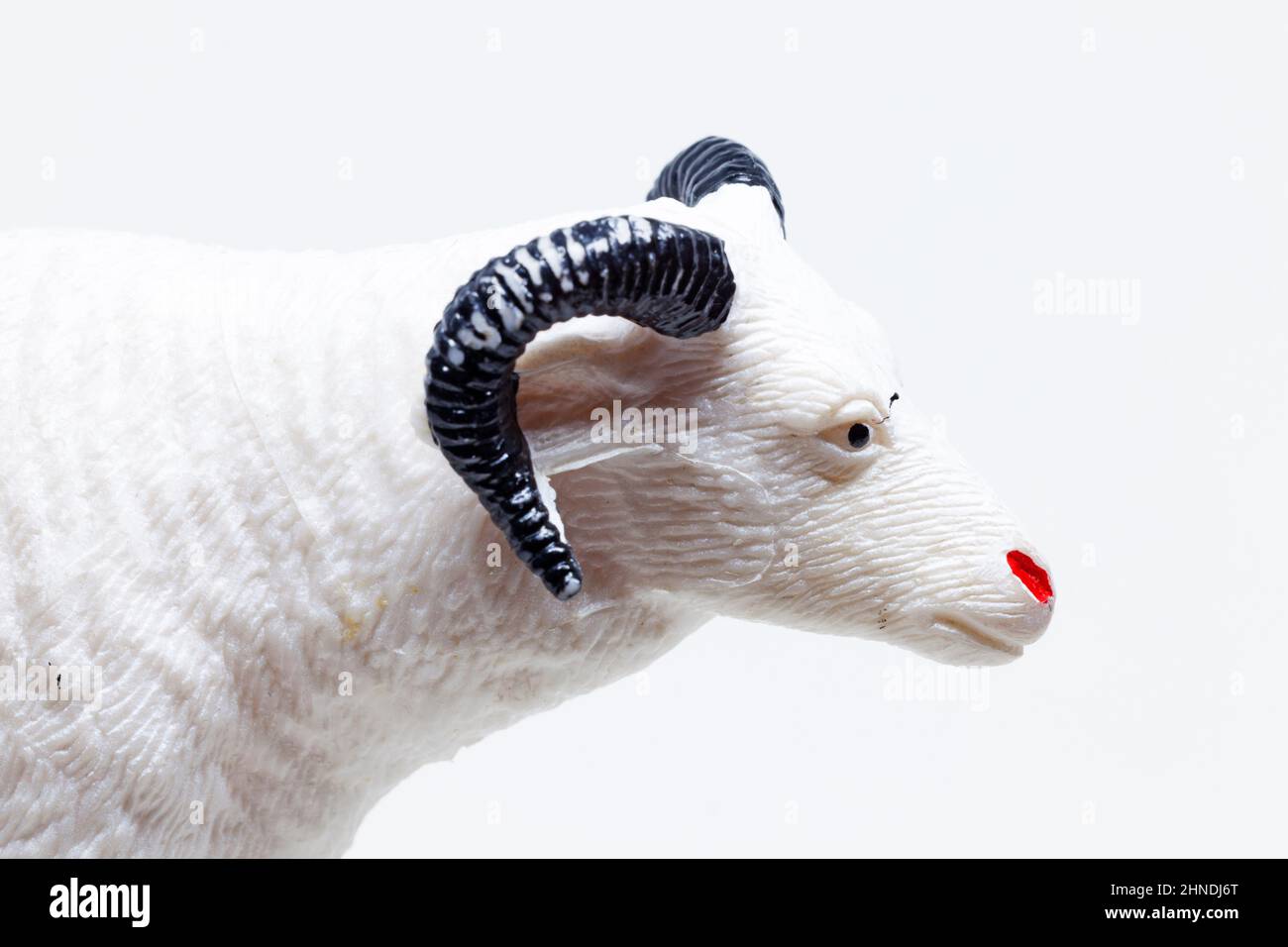 a white plastic toy depicting a goat Stock Photo Alamy