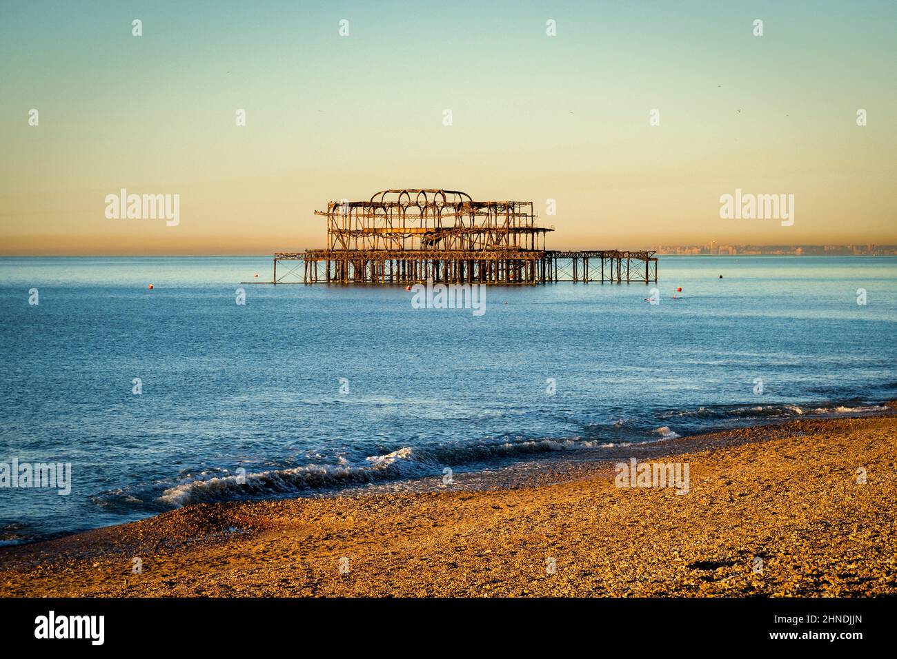 Sunrise at Brighton West Pier on a clear winter morning. Stock Photo
