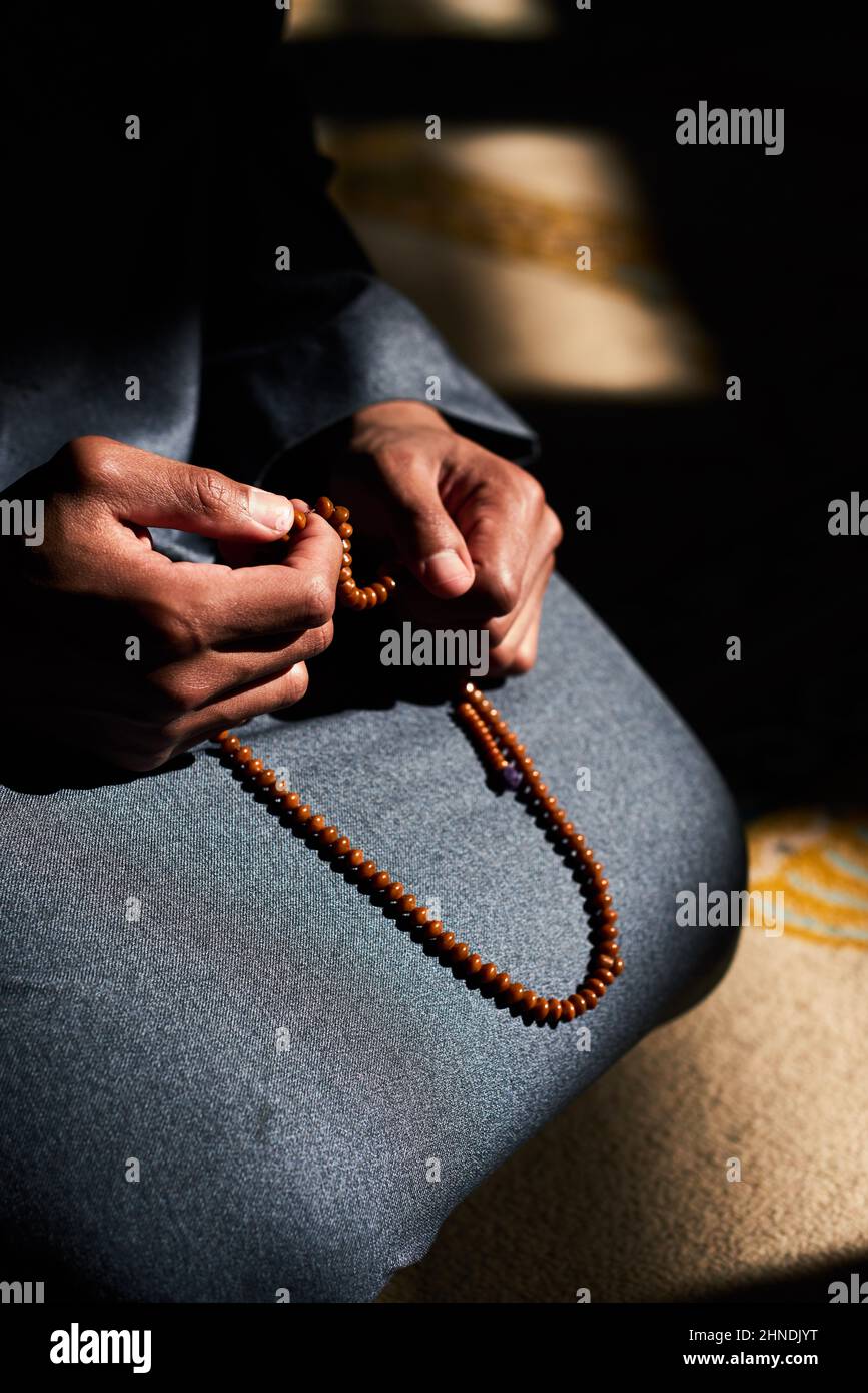 Close up of a Muslim man's hands holding prayer beads in a mosque Stock ...
