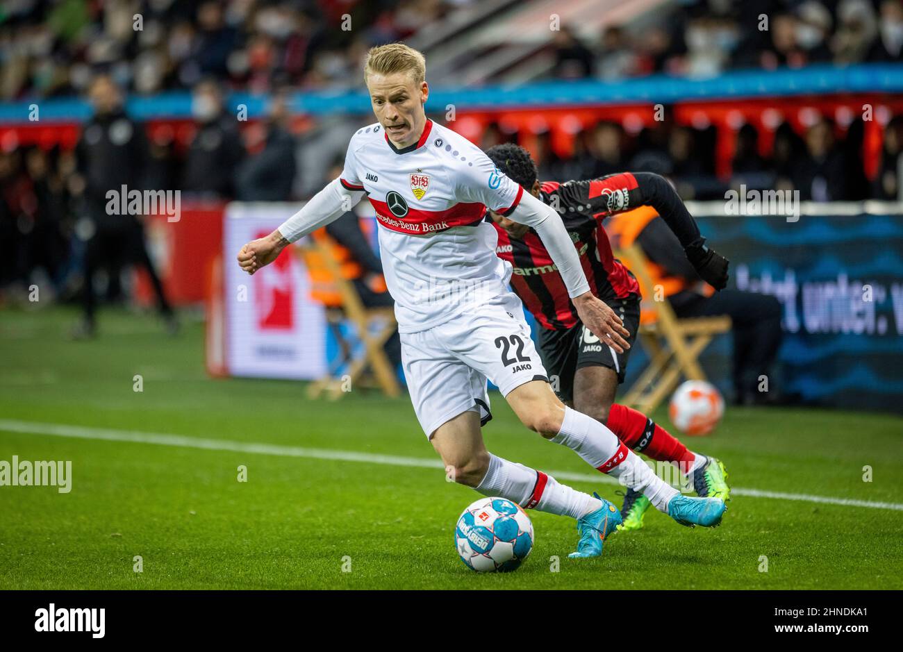 Chris Führich (VfB), Jeremie Frimpong (Leverkusen) Bayer Leverkusen - VfB  Stuttgart 12.02.2022, Fussball; Bundesliga, Saison 2021/22 Foto: Moritz Mül  Stock Photo - Alamy