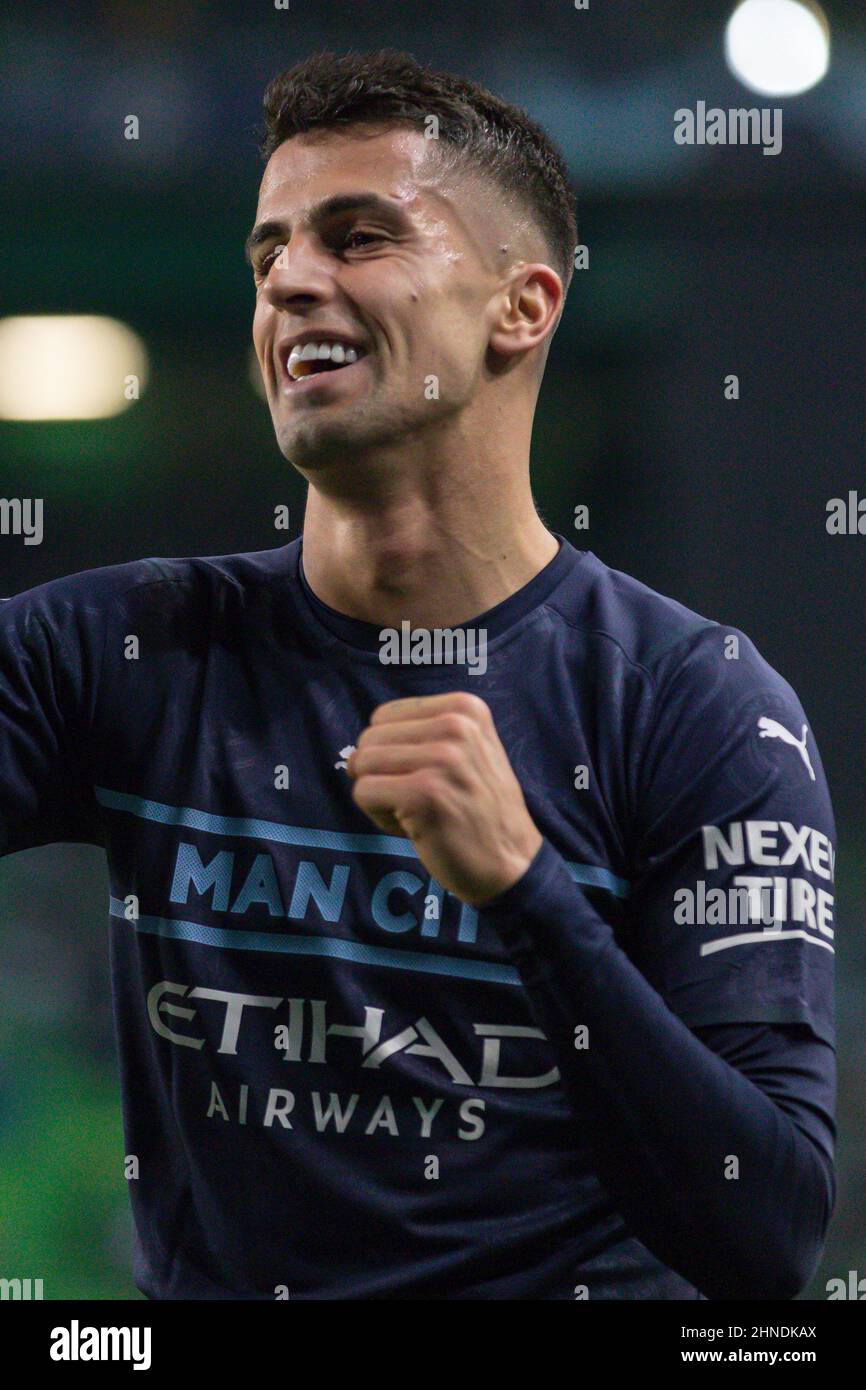 February 15, 2022. Lisbon, Portugal. Manchester City's defender from  Portugal Joao Cancelo (27) celebrating after a teammate scored a goal  during the game of the First Leg of Round of 16 for