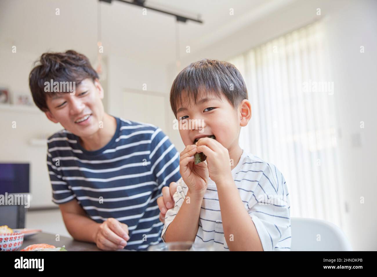 Boy eating sushi boy hi-res stock photography and images - Alamy