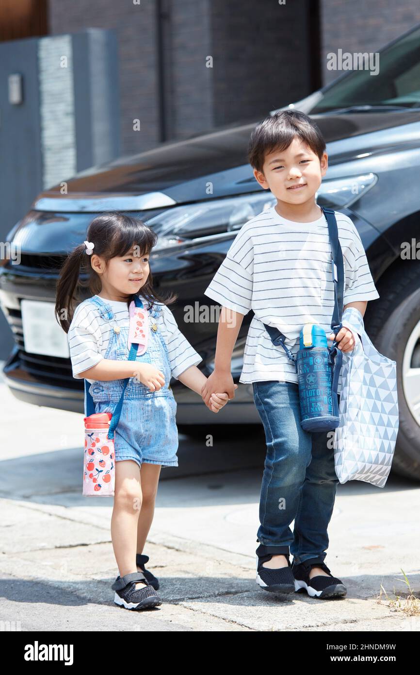 Japanese Brother And Sister Going On A Shopping Trip Stock Photo - Alamy