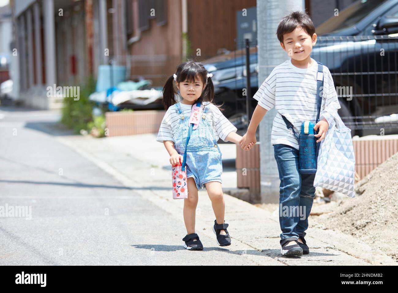 Japanese Brother And Sister Going On A Shopping Trip Stock Photo - Alamy