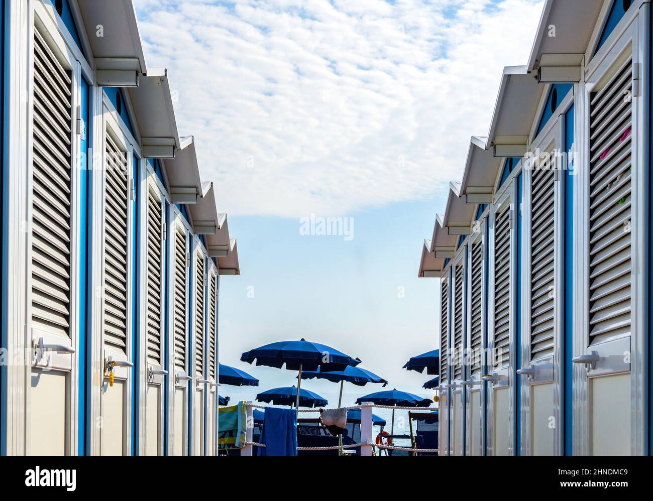 Italy, Liguria, Arenzano, beach huts and sunshade Stock Photo
