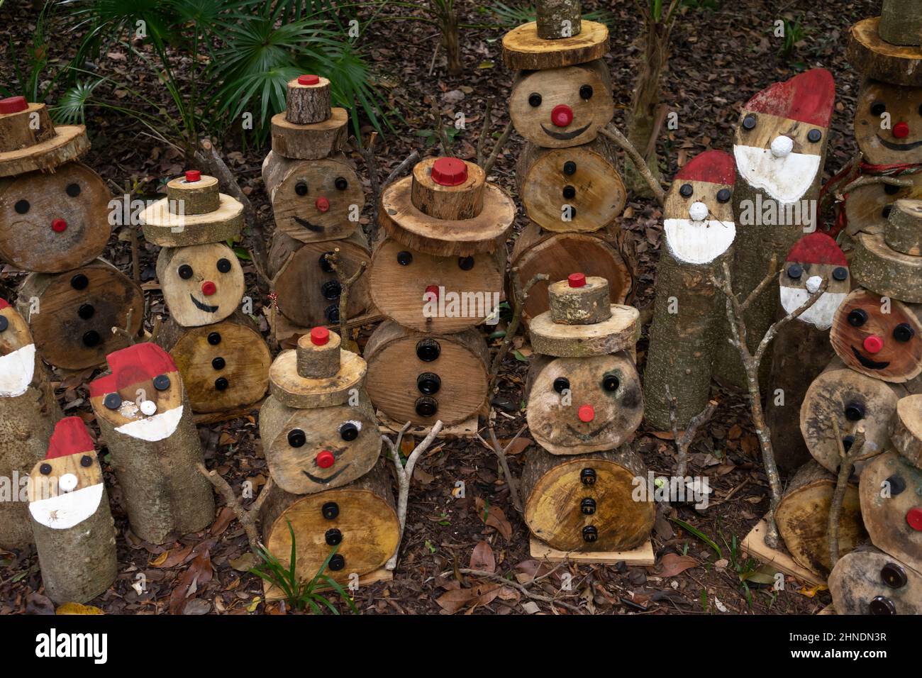 A group of cute little fantasy characters created with pieces of wood and tree bark in the tropical forest in Mexico Stock Photo