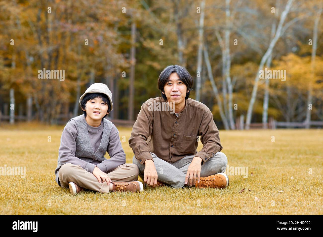 Japanese Family Sitting On The Lawn Stock Photo Alamy