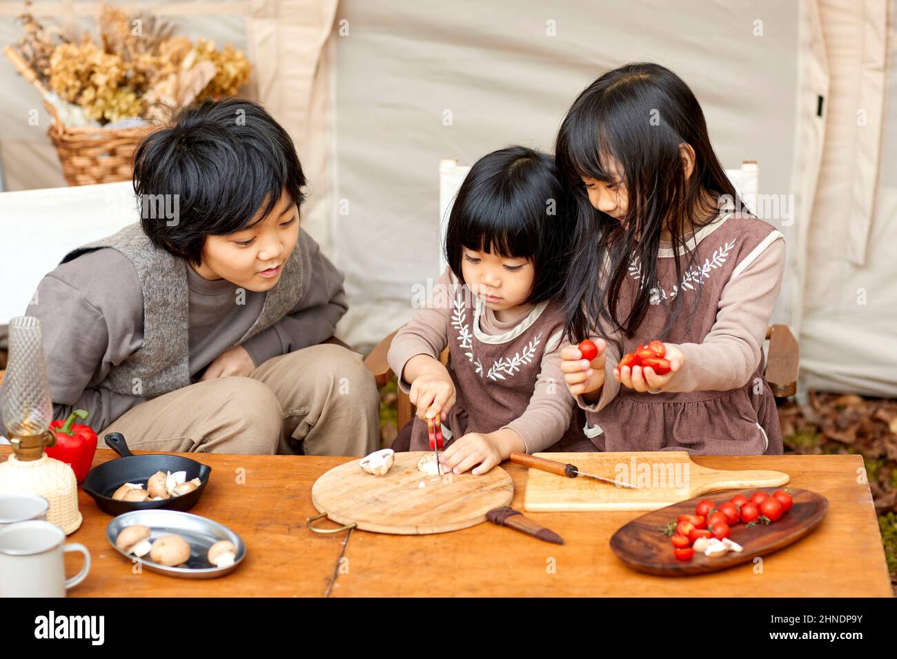 Japanese Siblings Making Camping Rice Stock Photo Alamy