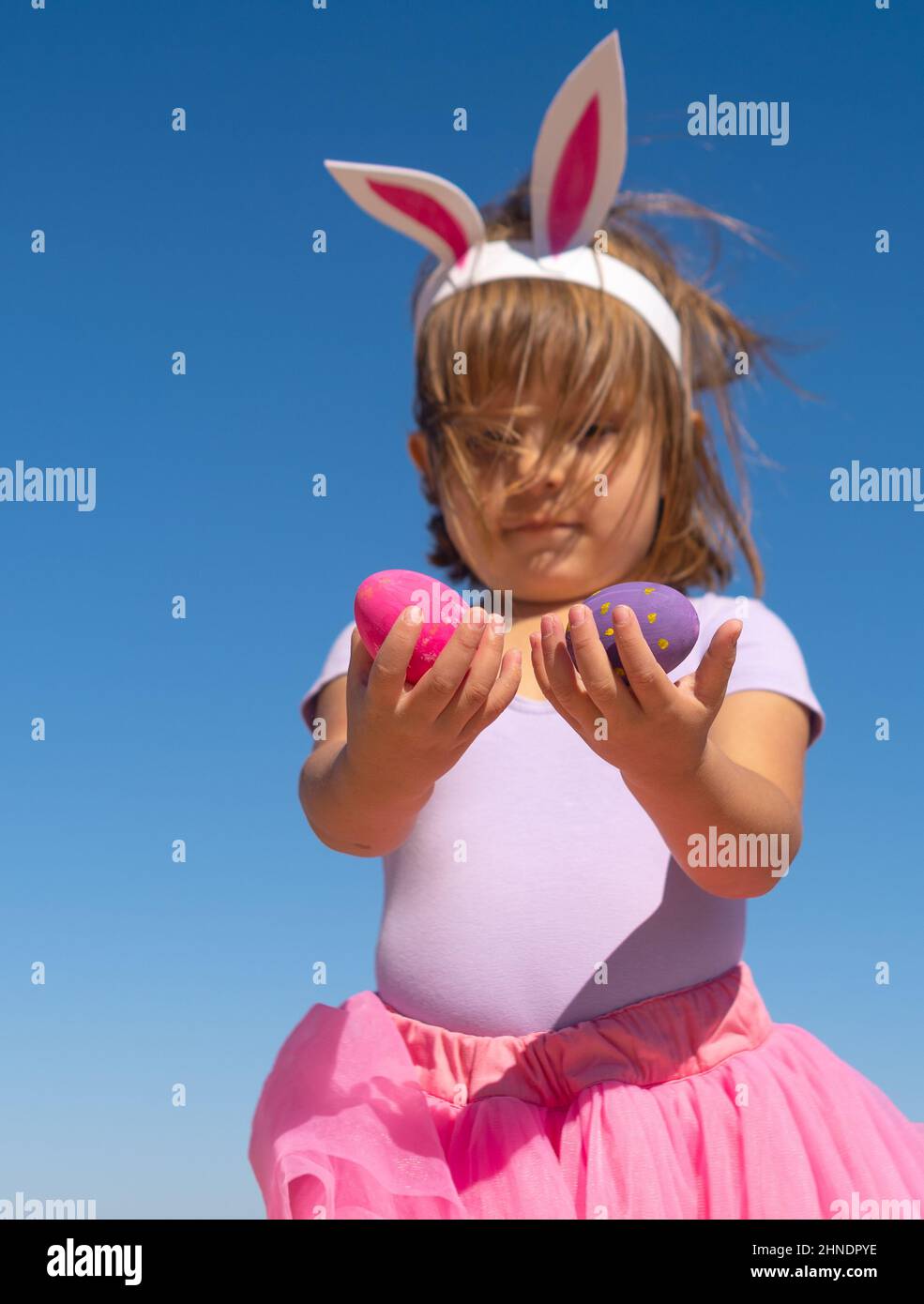 Little girl holding easter eggs Stock Photo