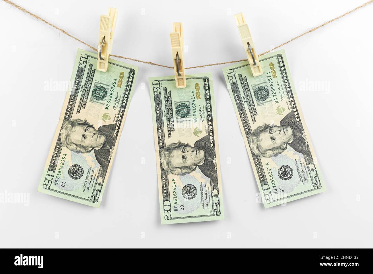 Money laundering. Dollar banknotes hanging on a rope, clothesline