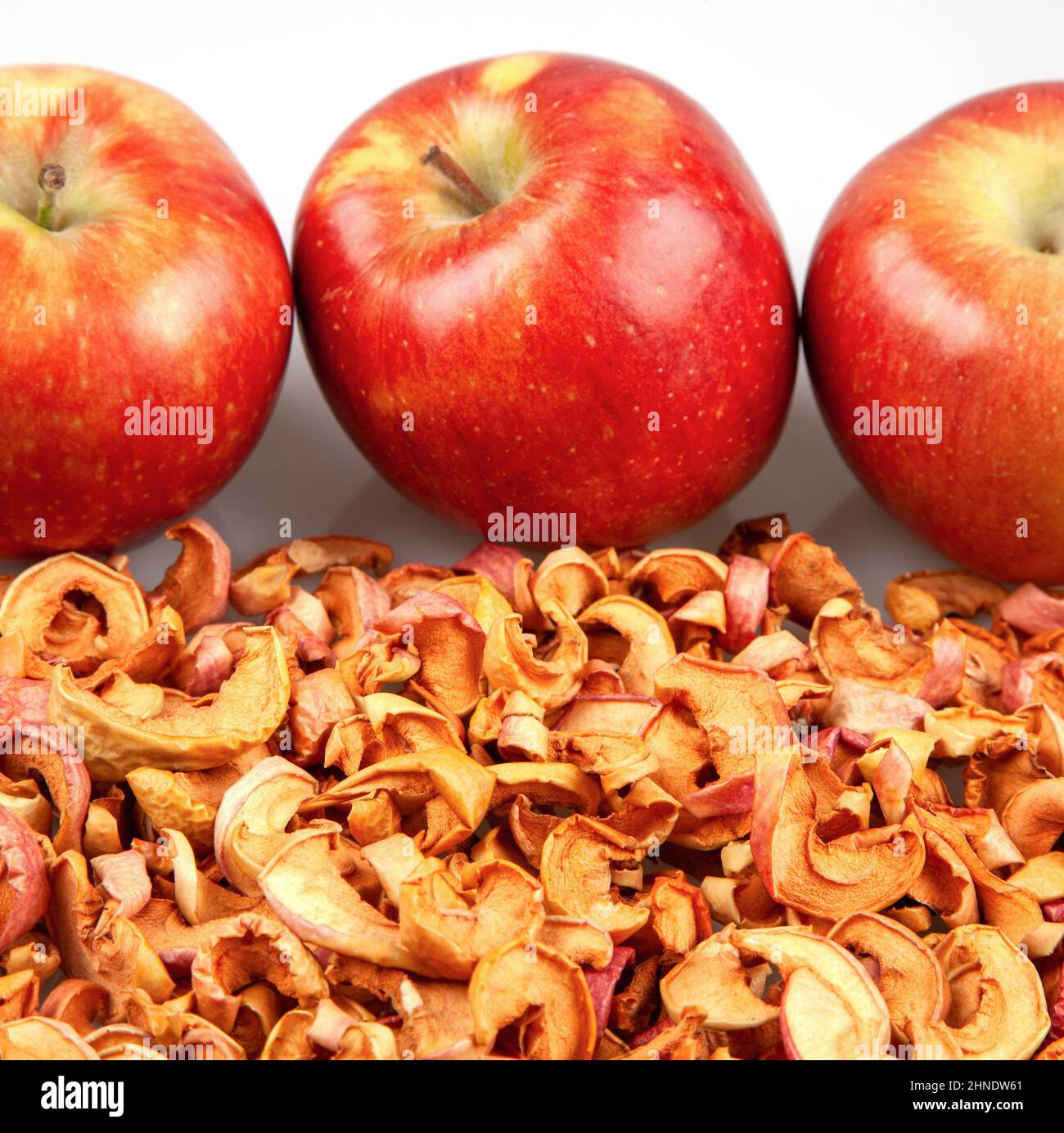 Fresh red apples on dried apple slices Stock Photo