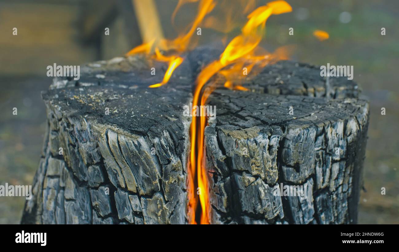 Swedish or finnish log candle. Fire burning from inside the wooden log