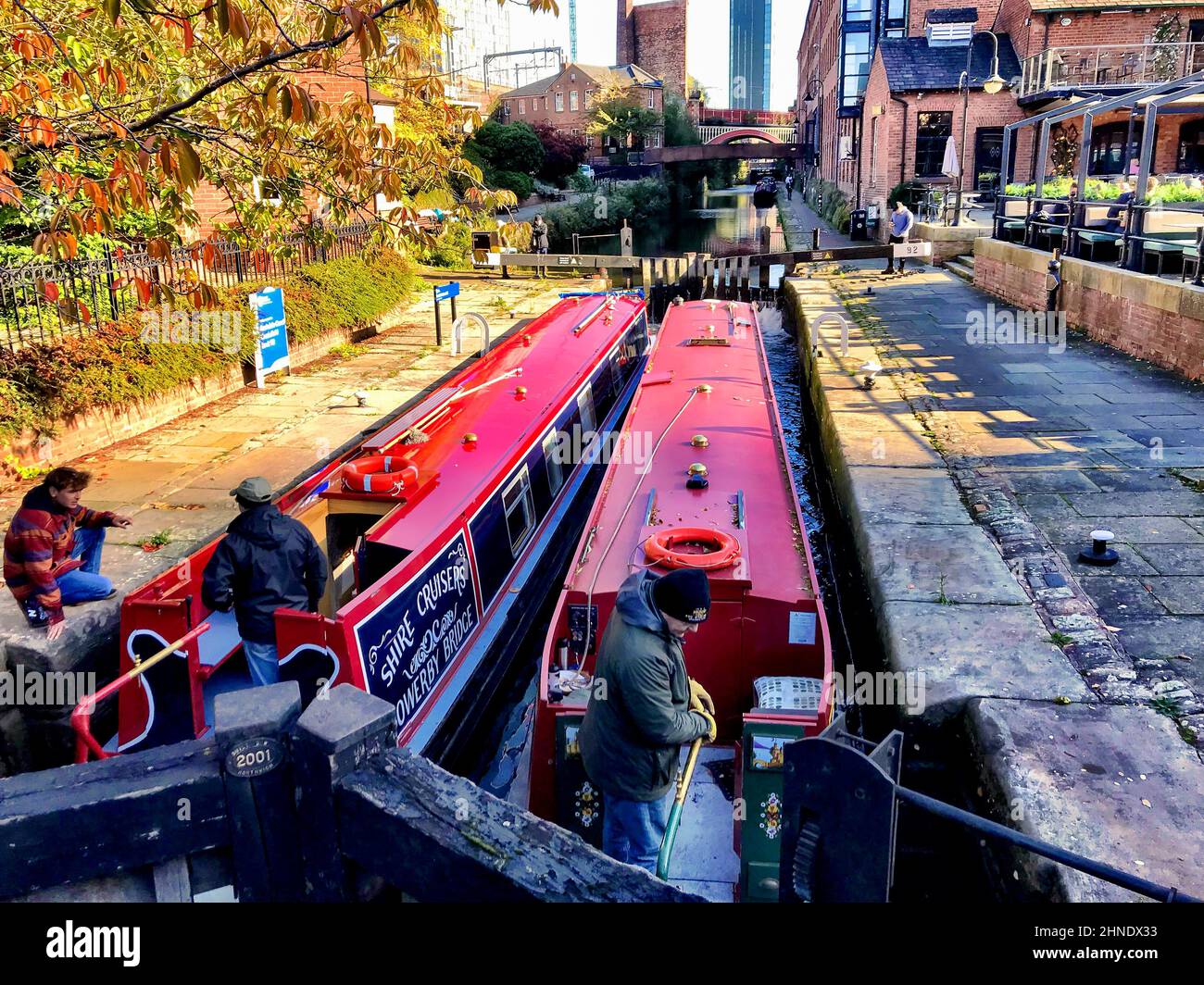 Two narrow boats in a lock on the Bridgewater Canal at Castlefields, Manchester Stock Photo