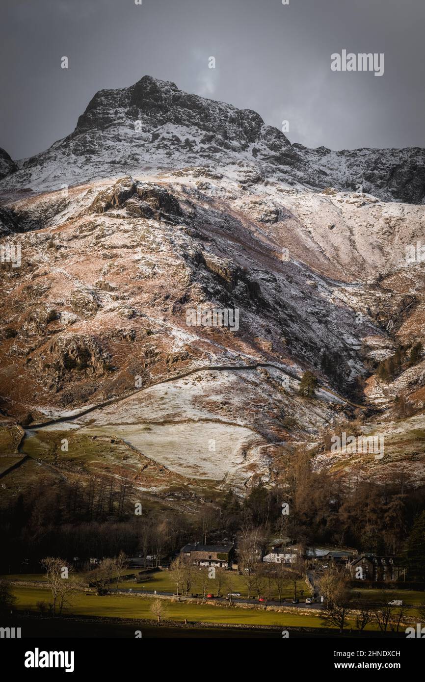 Imposing presence of Harrison Stickle rising up above Stickle Gill in the Langdale Valley Stock Photo
