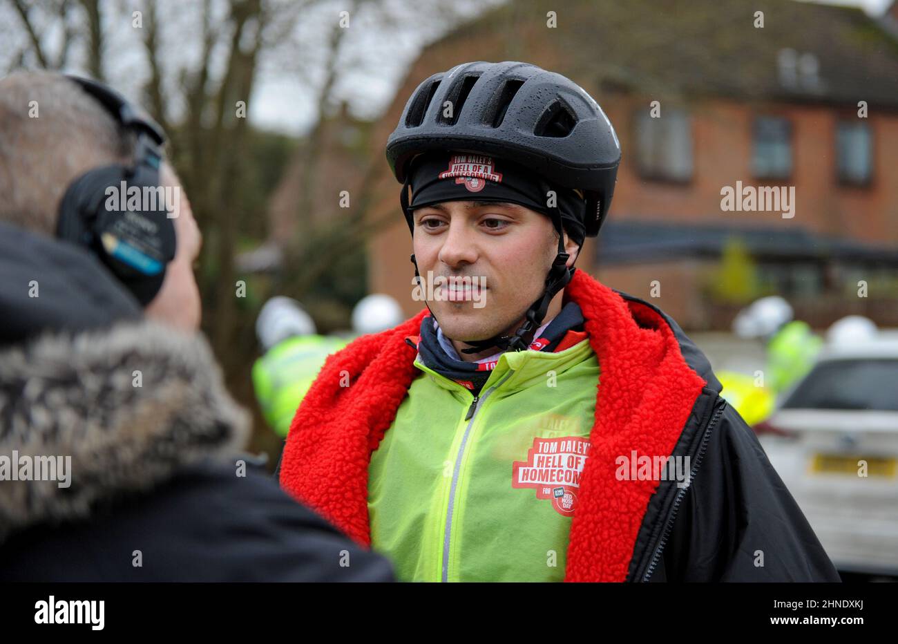 Winterbourne Abbas, Dorset, UK. 16th February 2022. Olympic gold medalists Tom Daley stops for lunch after 7 hours of riding on day 3 of his Comic Relief Hell of a Homecoming Challenge from the Queen Elizabeth Olympic Park in London to his hometown of Plymouth in Devon. On this leg he is cycling 130 miles from Southampton to Bovey Castle on Dartmoor in Devon. Credit: David Partridge / Alamy Live News Stock Photo