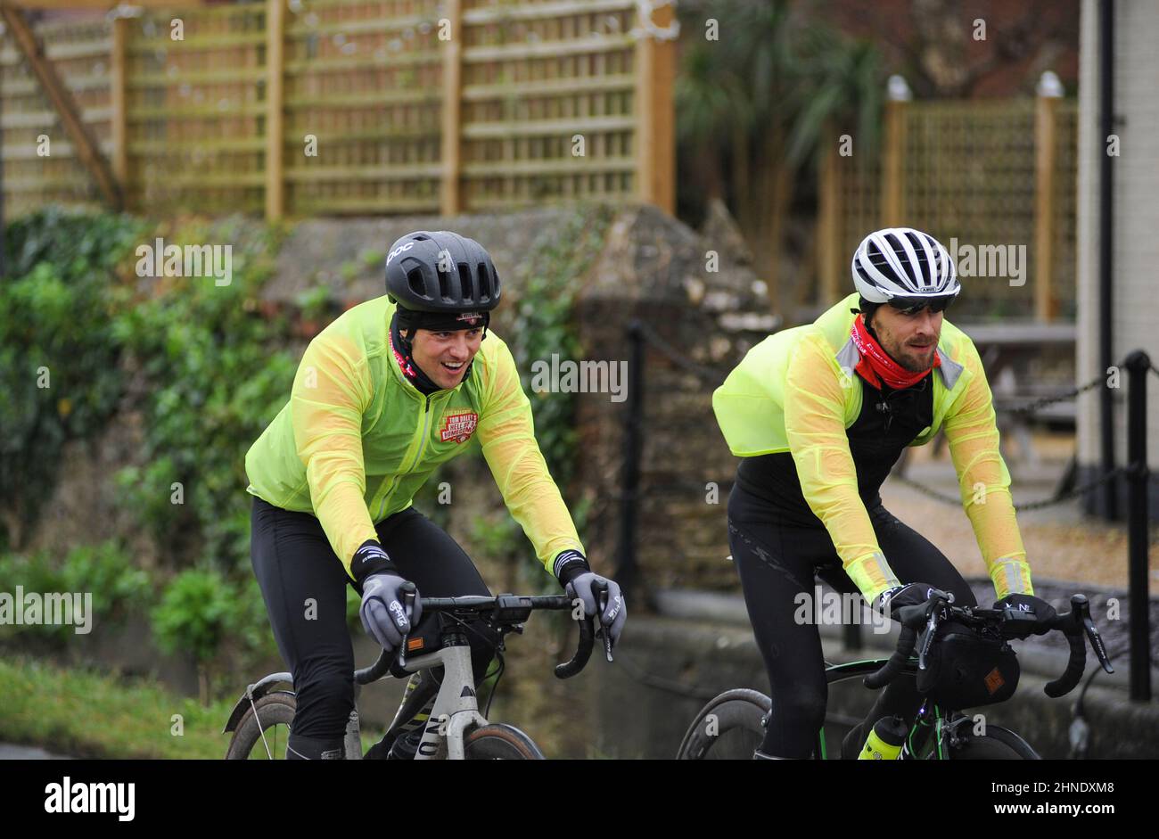 Winterbourne Abbas, Dorset, UK. 16th February 2022. Olympic gold medalists Tom Daley stops for lunch after 7 hours of riding on day 3 of his Comic Relief Hell of a Homecoming Challenge from the Queen Elizabeth Olympic Park in London to his hometown of Plymouth in Devon. On this leg he is cycling 130 miles from Southampton to Bovey Castle on Dartmoor in Devon. Credit: David Partridge / Alamy Live News Stock Photo