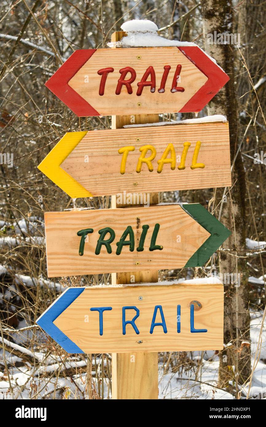 Colorful wooden trail signs Stock Photo - Alamy